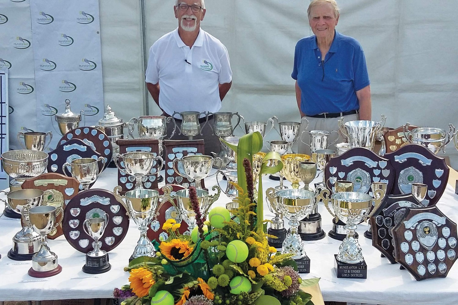 Tournament trophies - secretary Chris Holt (left) and president John Barrell at finals day 2019